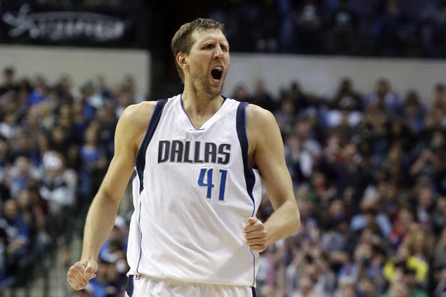 Dirk Nowitzki of Dallas Mavericks disagrees with Kareem Abdul