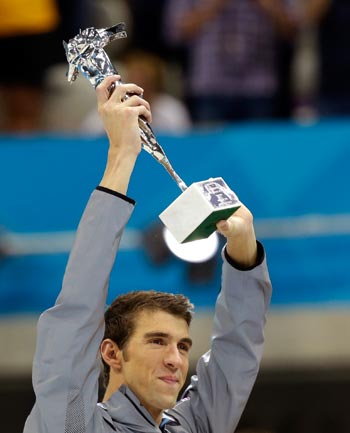 Michael Phelps of the US lifts a silver trophy after being honored as the most decorated Olympian at the Aquatics Centre in the Olympic Park during the 2012 Summer Olympics in London. Phelps was honored with a special individual ceremony after concluding his record-breaking career as the most decorated Olympian. AP Michael Phelps of the US lifts a silver trophy after being honored as the most decorated Olympian at the Aquatics Centre in the Olympic Park during the 2012 Summer Olympics in London. Phelps was honored with a special individual ceremony after concluding his record-breaking career as the most decorated Olympian. AP