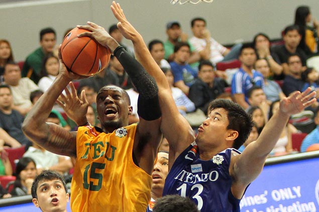 Ateneo forward Ryan Buenafe, right, fired in a career-high 29 points in the Blue Eagles' 75-79 overtime loss to the FEU Tamaraws. Jerome Ascano