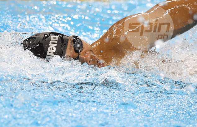 Swimmer Jessie Lacuna follows Ian Lariba on the sidelines after failing to advance in Rio Olympics