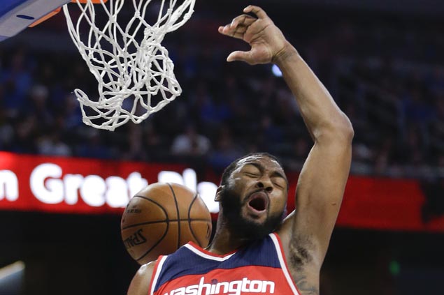 Wizards take early double-digit lead and hold off Magic for first road win