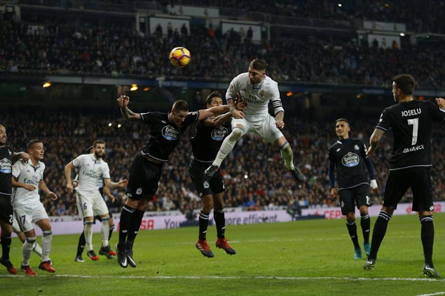 Real Madrid sets club record 35 straight games without a loss with slim win over Deportivo