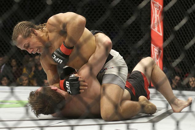 Urijah Faber survives early knockdown in UFC Fight Night to outpoint Brad Pickett in farewell bout