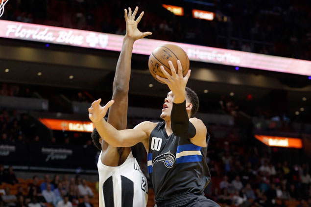 Magic overcome skidding Heat in double overtime