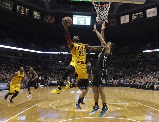 LeBron James feeling it from beyond the arc, shoots down Bucks with five treys