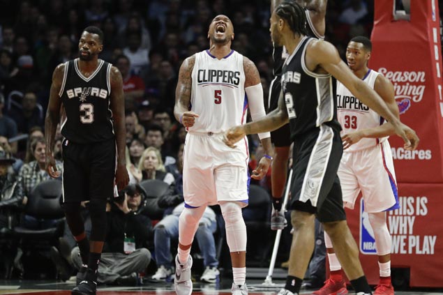 Undermanned Clippers buck late injury on Chris Paul to halt Spurs five-game win run