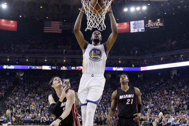 Warriors pull away late to waste Whiteside's 20-20 game and turn back slumping Heat