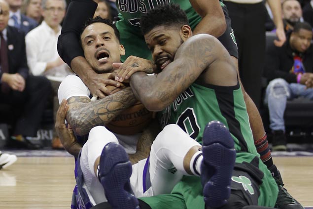 Undermanned Kings buck slow start with scorching finish to halt Celtics' win run at seven