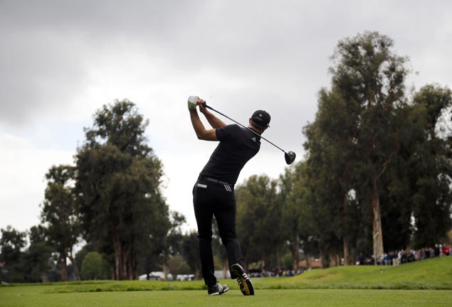 Dustin Johnson one stroke ahead after 36 holes at rainy Riviera