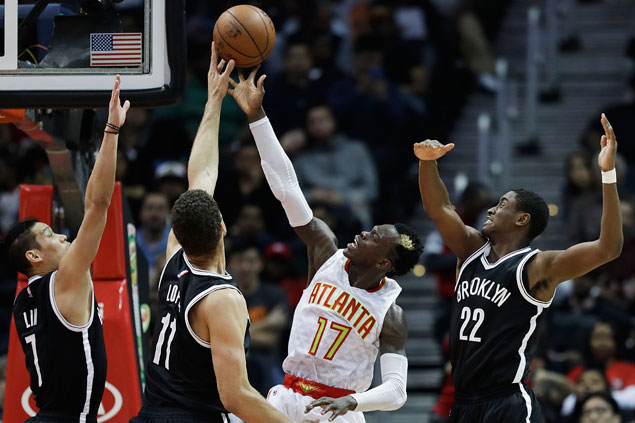 Hawks arrest three-game slide with rout of cellar-dwelling Nets