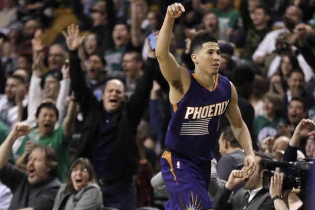 Celtics fans roar, players frown as Devin Booker becomes youngest to score 70 in loss to Boston