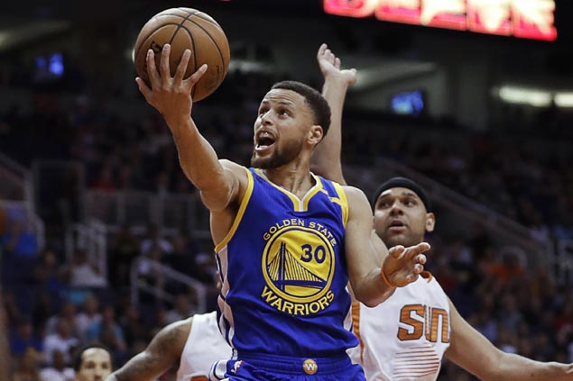 Streaking Warriors survive scare against slumping Suns to clinch West ...