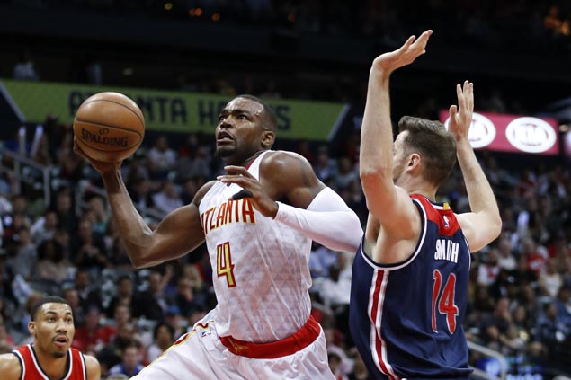 Hawks use balanced scoring to even series with Wizards