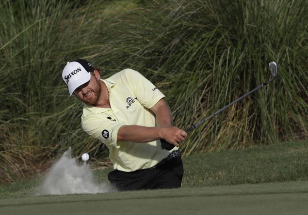 Remarkable recoveries from wild drives put JB Holmes in share of lead at Sawgrass
