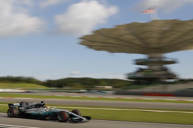 Another brilliant drive earns Lewis Hamilton pole at Sepang as Sebastian Vettel misery continues