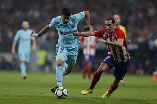 Messi contained but Suarez scores as Barca salvages draw to extend unbeaten run against Atletico