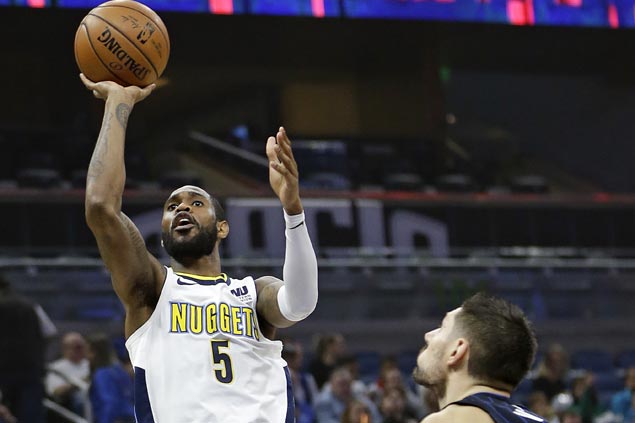Nuggets recover from slow start to get past Magic