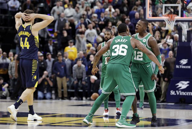 Celtics squander huge early lead but mount late rally, capped by Terry Rozier dunk, to nip Pacers