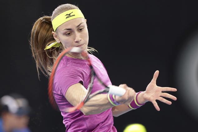 Aleksandra Krunic marches on to Brisbane quarters as top seed Garbine Muguruza retires with cramps