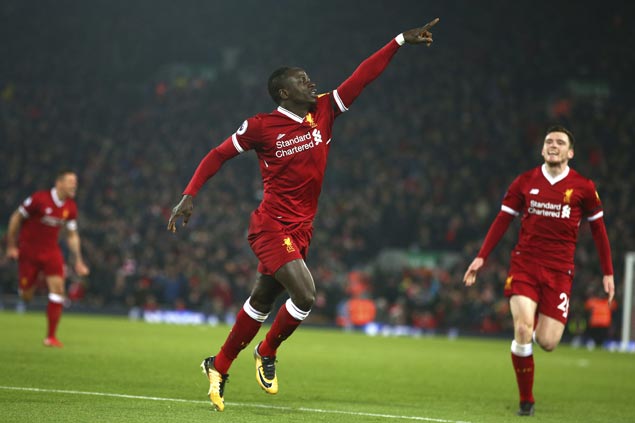 Liverpool scores three goals in nine minutes, survives nervy finish to end City’s 22-match unbeaten run