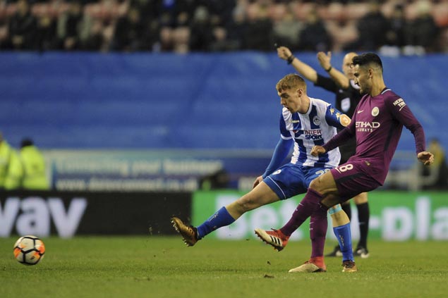 Third-tier Wigan scores stunning FA Cup fifth-round win to end Man City’s quadruple bid