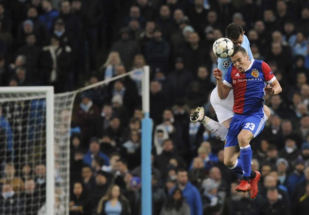Man City squeezes into Champions League quarters with home loss to Basel