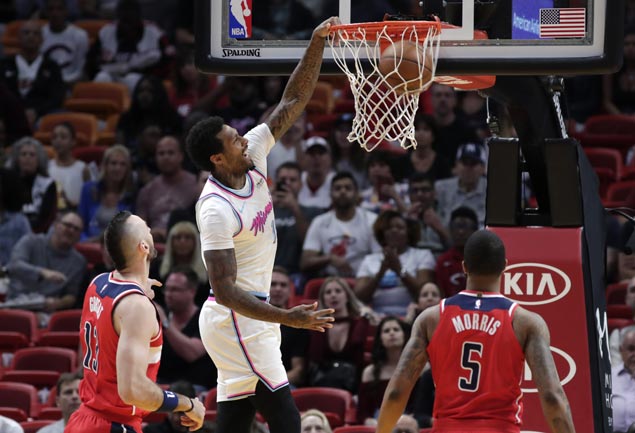 Johnson stars as Heat score wire-to-wire win over Wizards but Wade suffers hamstring strain