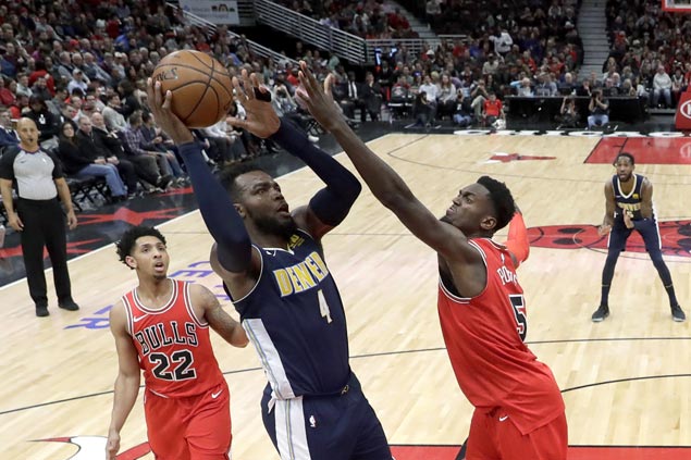 Nuggets rout Bulls to close gap on Jazz in race for eighth spot in West