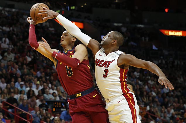 Wade throws block party as stifling Heat defense, Love early exit leave Cavs in disarray