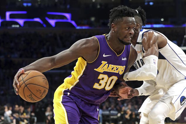 Randle posts double-double to power Lakers past Mavs as Ball leaves early with knee contusion