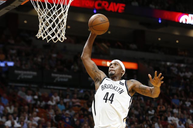 Nets win in overtime to keep Heat from securing playoff spot