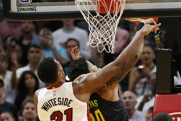 After controversial statements, Whiteside lets game do the talking as Heat secure playoff spot