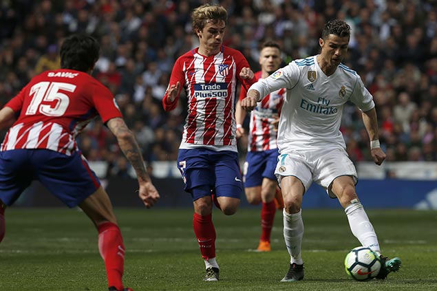 Griezmann matches Ronaldo as Atletico earns draw with Real in Madrid derby