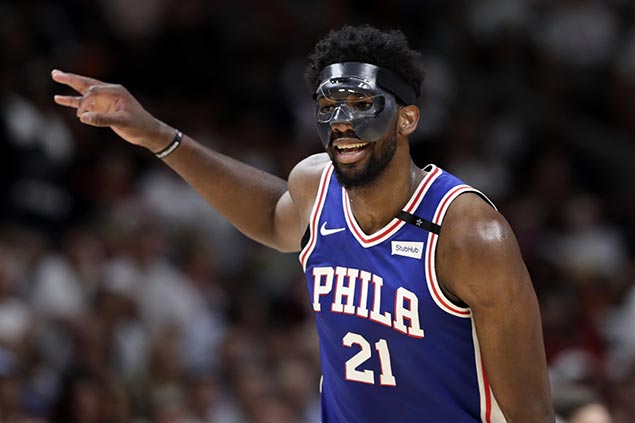 Embiid makes winning playoff debut, powers late surge as Sixers regain control over Heat