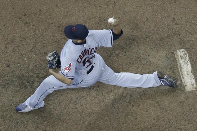 Carlos Carrasco Ks 14 in complete game, drives in a run as Indians down Brewers