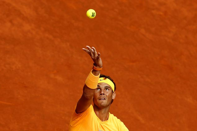 Rafael Nadal sustains fine form on clay as Novak Djokovic makes another early exit