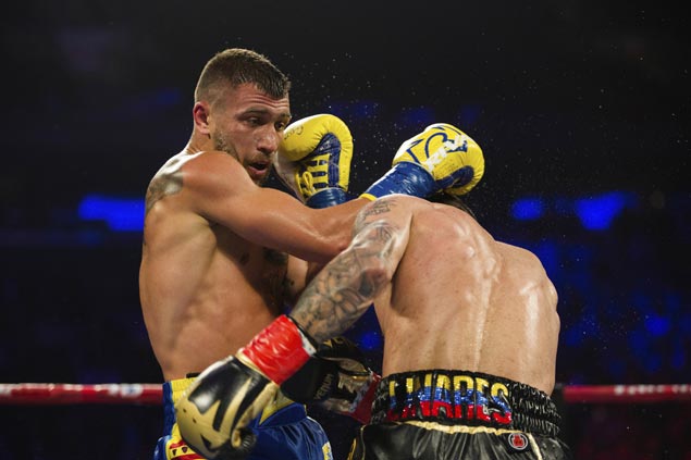 Lomachenko stops Linares in 10th round of lightweight bout to bag title in his third weight class