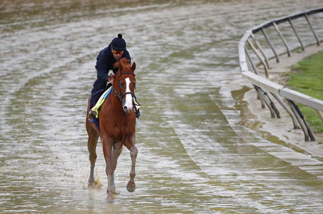 Justify shows no sign of heel bruise in workout at soggy Pimlico track ahead of Preakness
