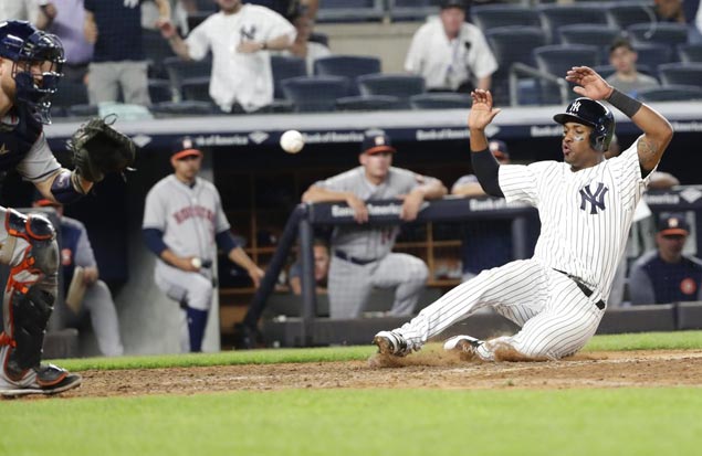 Yankees overcome five errors to beat Astros in 10 innings