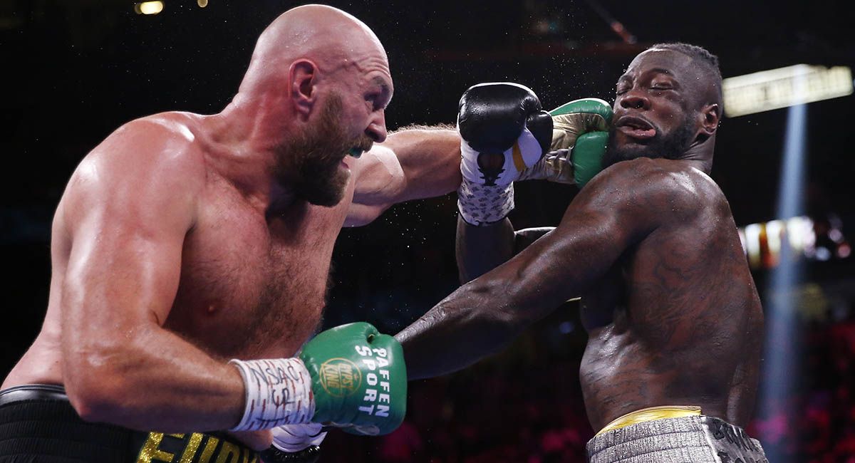 Tyson Fury lands a big left on Deontay Wilder's chin. 