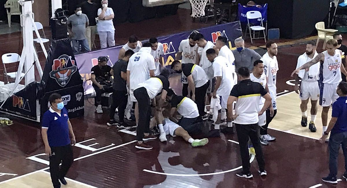 TNT staff attend to a fallen Troy Rosario in Game 3.