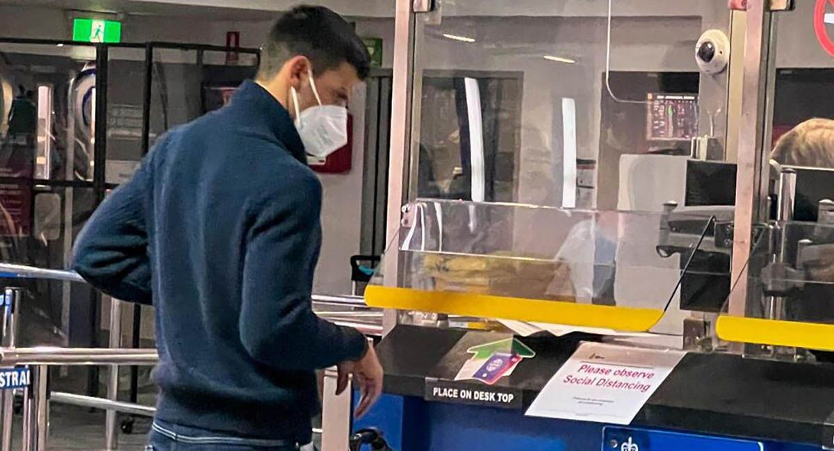 Novak Djokovic waits at an Australian Border Force desk on his arrival at Melbourne Airport, Jan. 5, 2022.