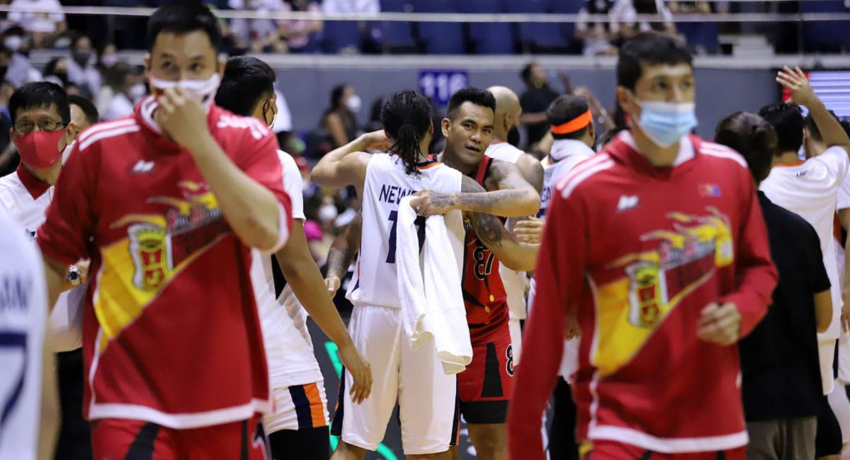 SMB forward Vic Manuel and Meralco's Chris Newsome hug it out after the game.