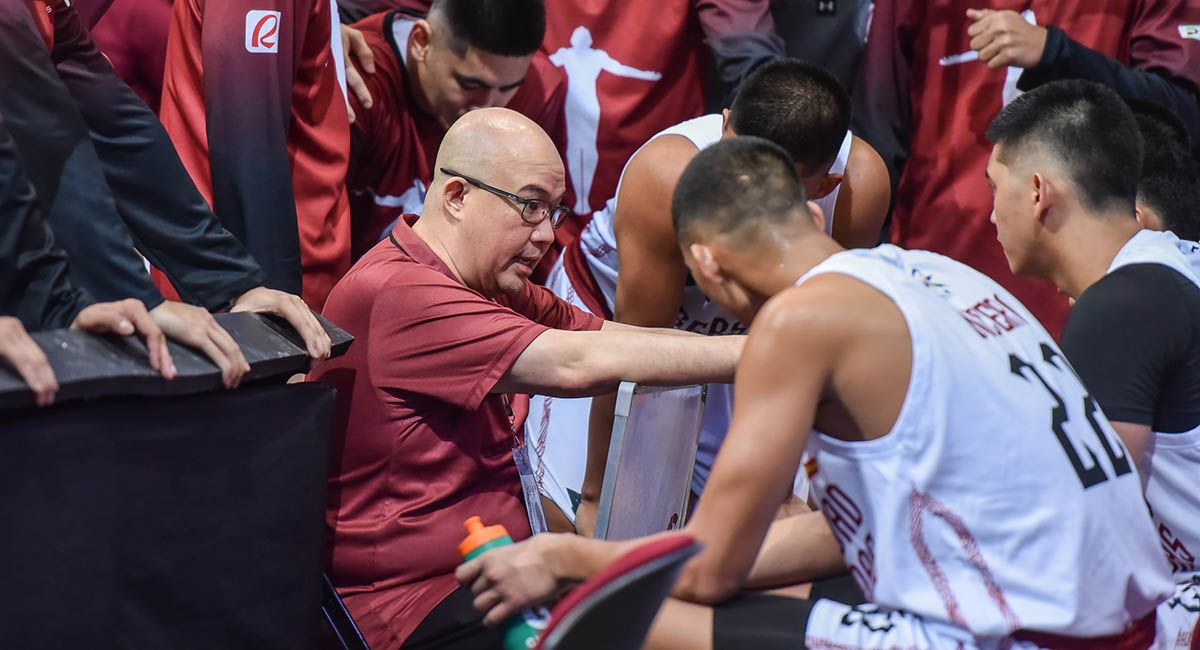 UP coach Goldwin Monteverde gives instructions during a huddle.