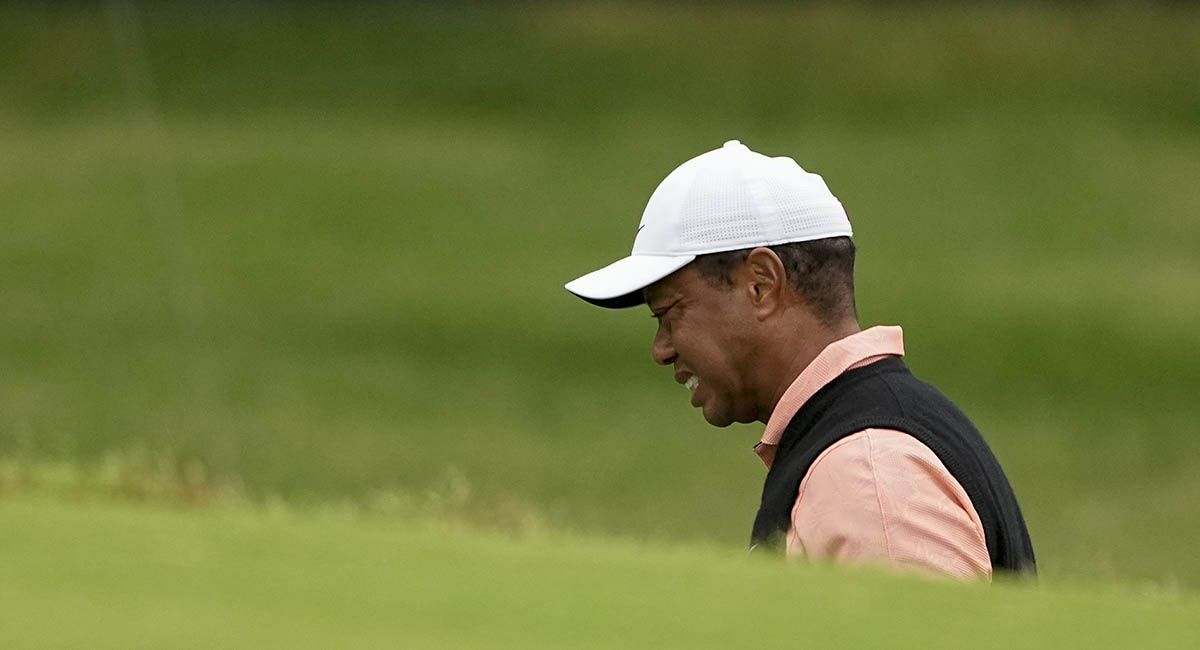 Tiger Woods in obvious pain during the third round of the PBA Championship.