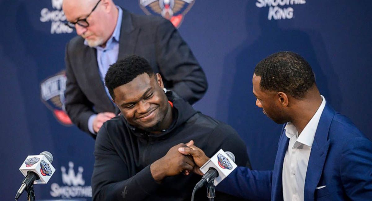 Zion Williamson all smiles as he signs his multi-year contract with the Pelicans.
