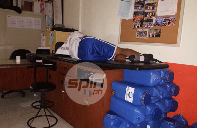 Para sa bayan: Troy Rosario catches nap in gym in between practices of Gilas, Seaba-bound cadets