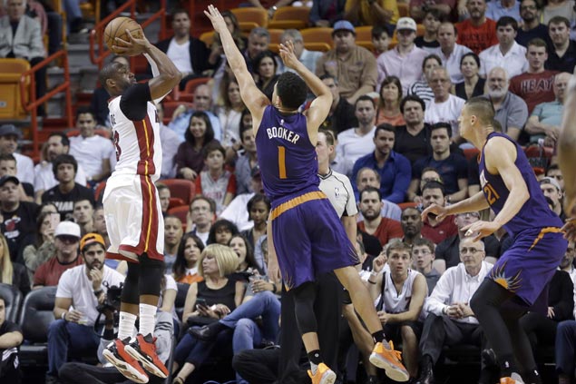 Heat overcome career game from Suns' Devin Booker, cruise to third straight win